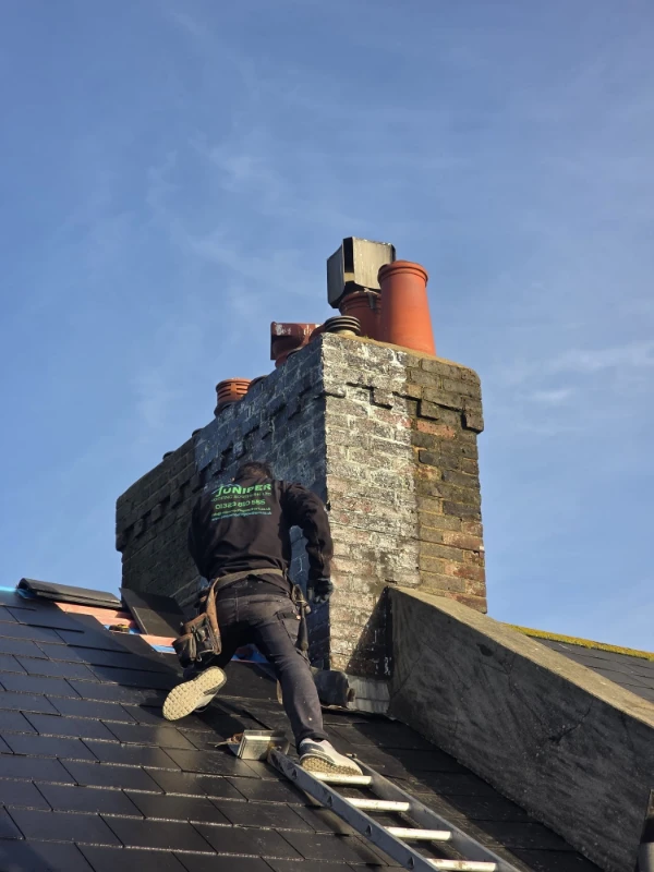 Juniper Roofing Southern Team Member on the roof