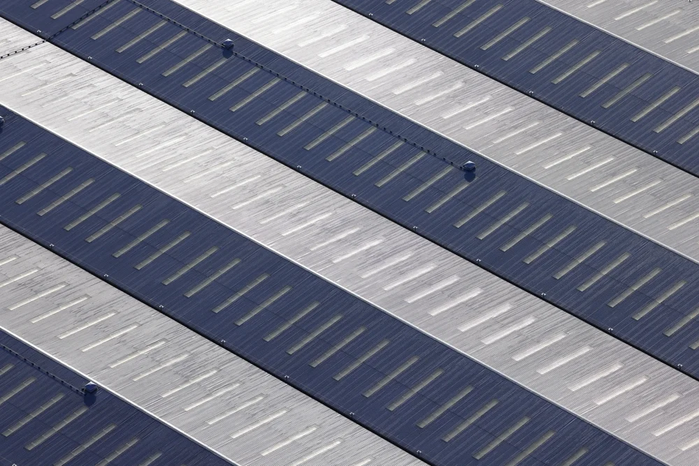 steel roof installation on a series of warehouses